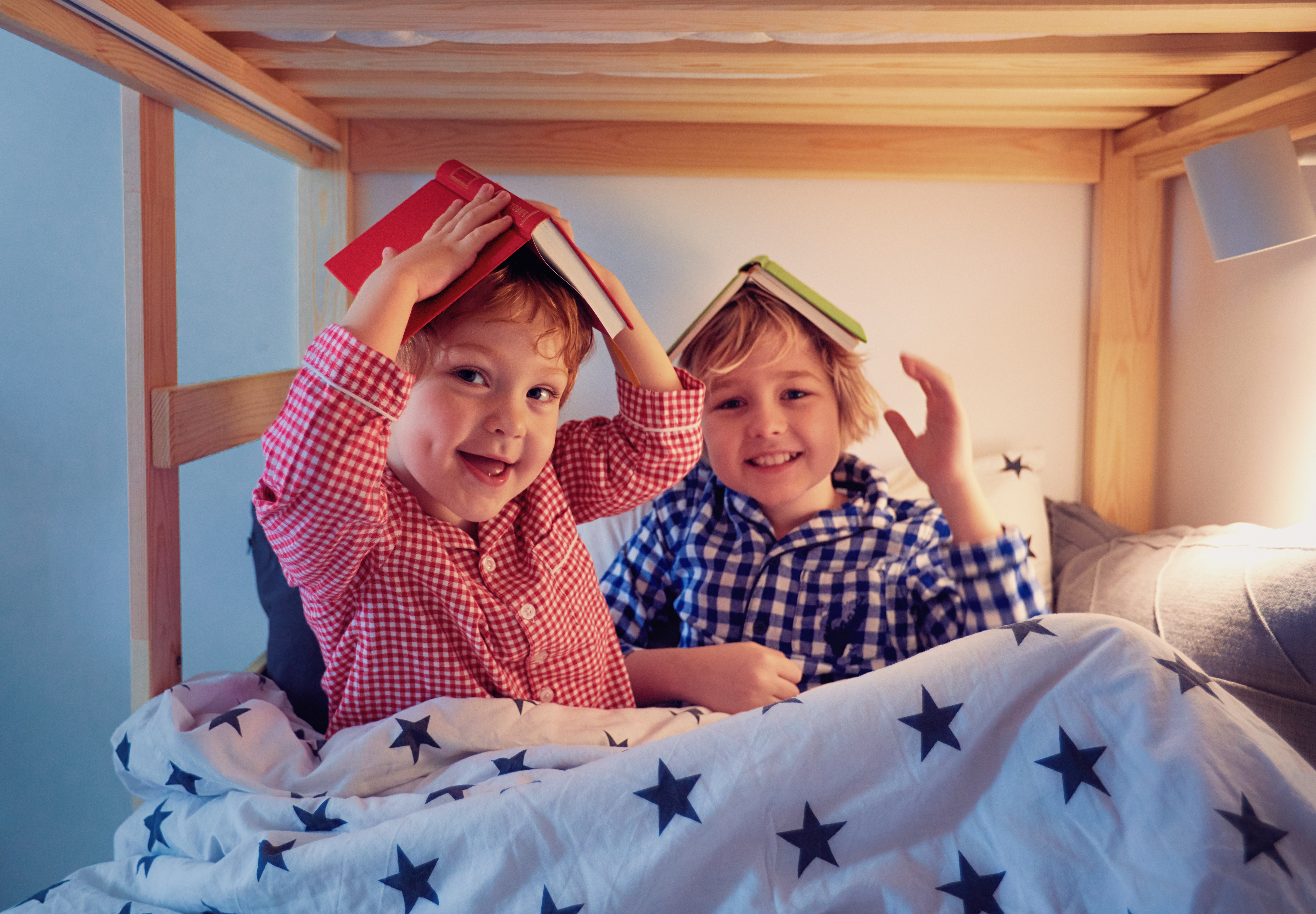 Kids smiling in bed