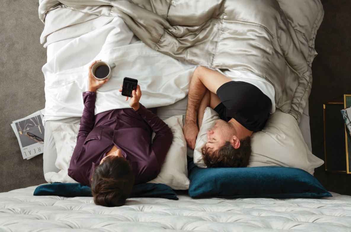 overhead shot of couple sleeping on Beautyrest Black mattress