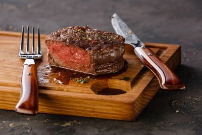 A cut steak with cutlery 