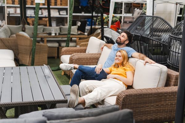 Couple Trying Out Outdoor Furniture