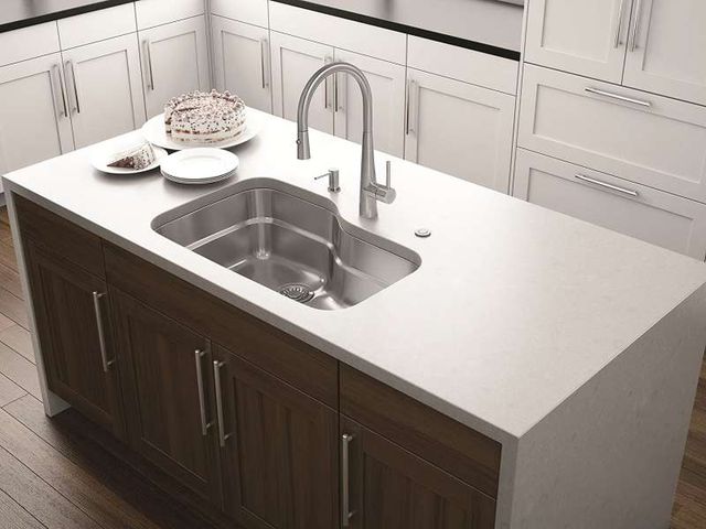 Front view of a modern kitchen with a FRANKE sink and faucet