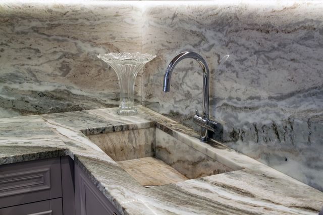 Credit: iStock Close view of a small granite wet bar sink