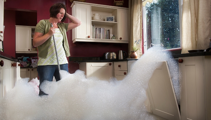 Woman appalled at the bubbles coming out of her dishwasher