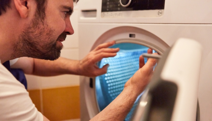 Service tech checking out a dryer