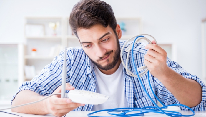 Man struggling with the router and connection issues