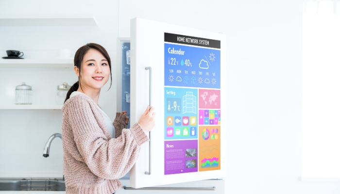 Happy women opening smart fridge