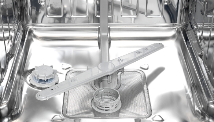 Closeup of the dishwasher spray arm