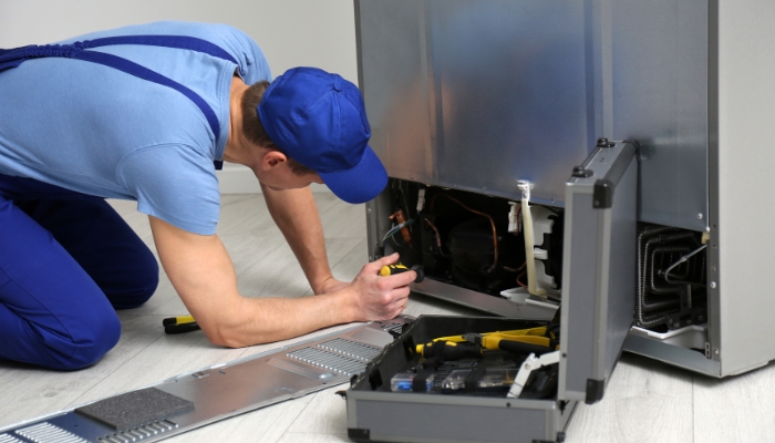 Service professional checking the back panel
