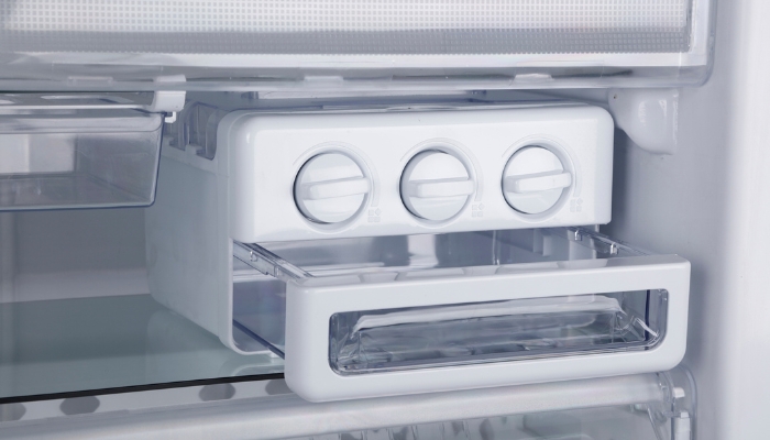 Close-up of ice maker in the refrigerator