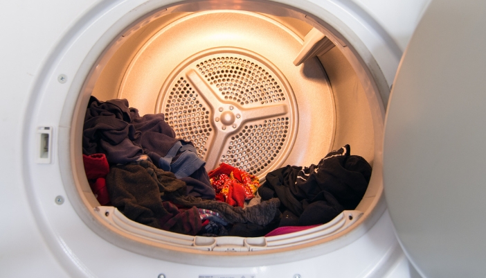 Closeup of a load of damp clothes sitting in the dryer