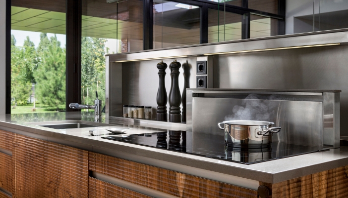 A pot of food cooking on a luxury induction cooktop