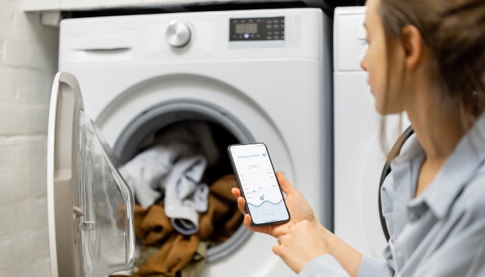 Closeup of woman getting a real-time alert about her laundry