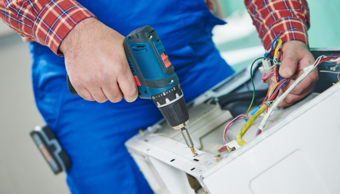 Professional tech opening washer machine