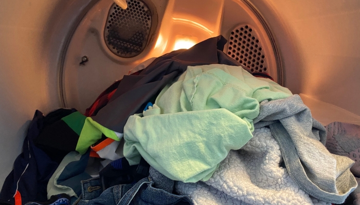 Serv_Dryer-Maintenance-Matters_4.jpg Interior view of half of load of laundry in the dryer