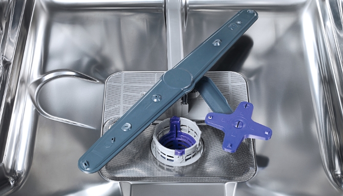 Closeup of the spray arms of a dishwasher