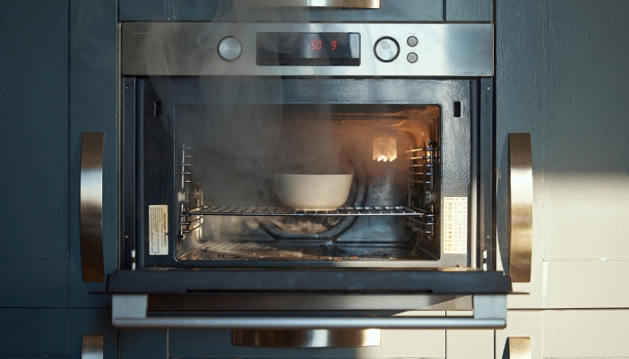 Closeup of an oven smoking