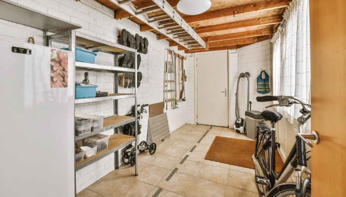 Closeup of upright freezer in the utility room with little insulation