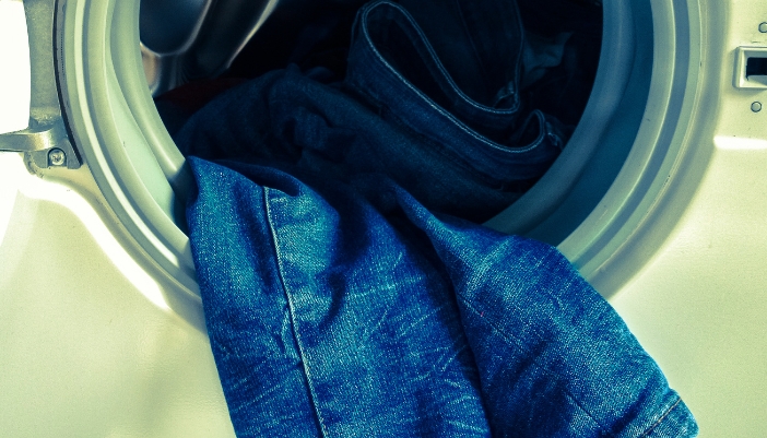 Closeup of stiff clothes coming out of washer