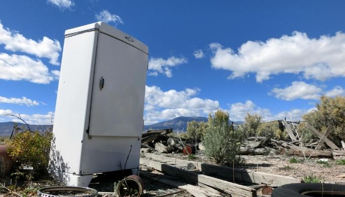 Old fridge in wasteland