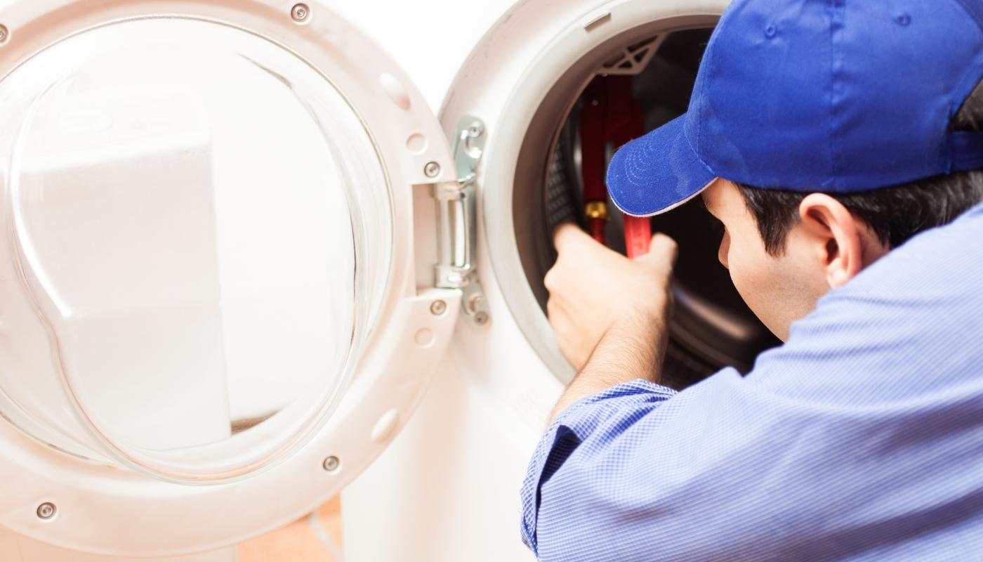 man trying to fix washer