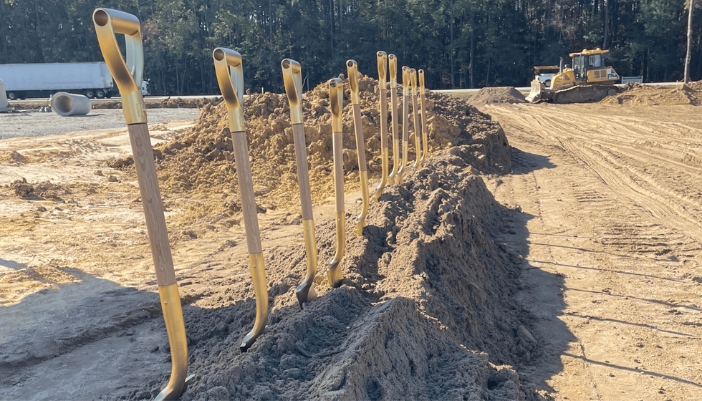 A line of shovels in the ground.