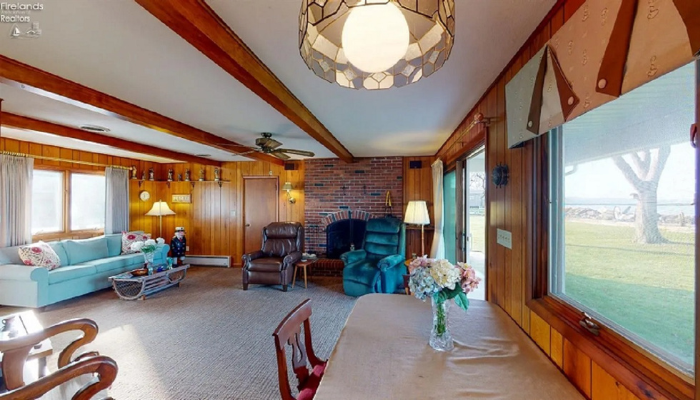 lakeside home with dated interior paneling and fixtures