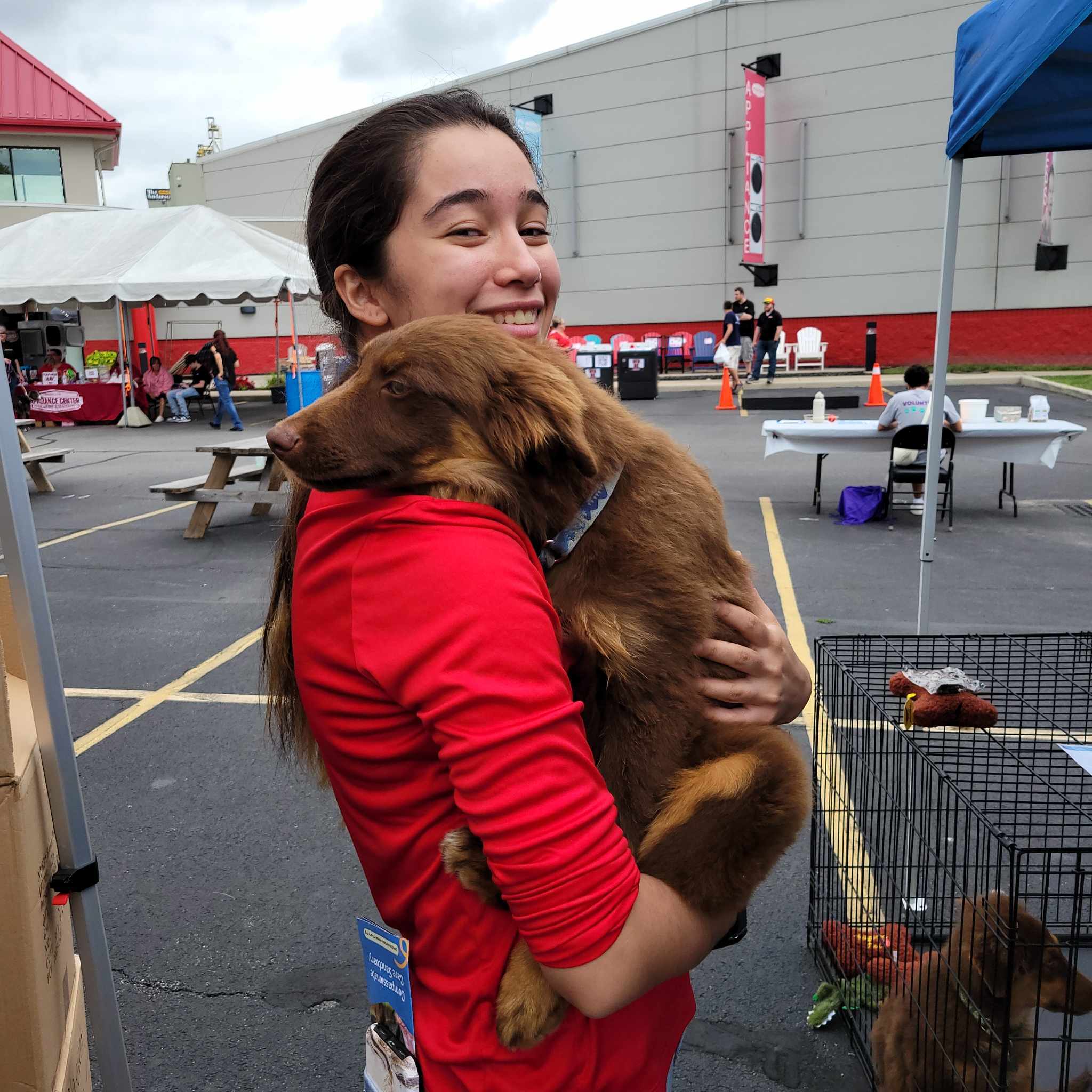 Lady adopting a dog at the event