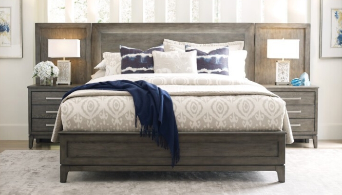A modern bedroom set in dark wood with neutral accents.