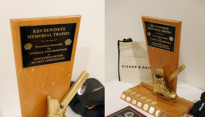 A trophy with a gleaming gold plaque, signifying a notable achievement.