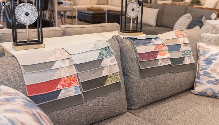 fabric swatches laying on a sofa
