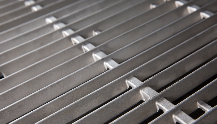A stainless steel grill rack close-up.
