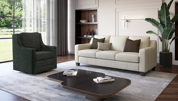 A modern living room with neutral decor and a dark green armchair.