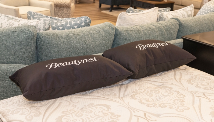 A close-up of a BeautyRest mattress and pillows in a Smitty's showroom.