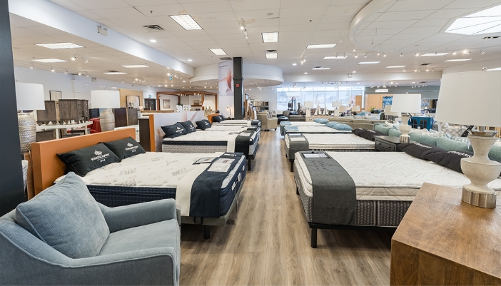A Smitty's showroom of mattresses and bedding.