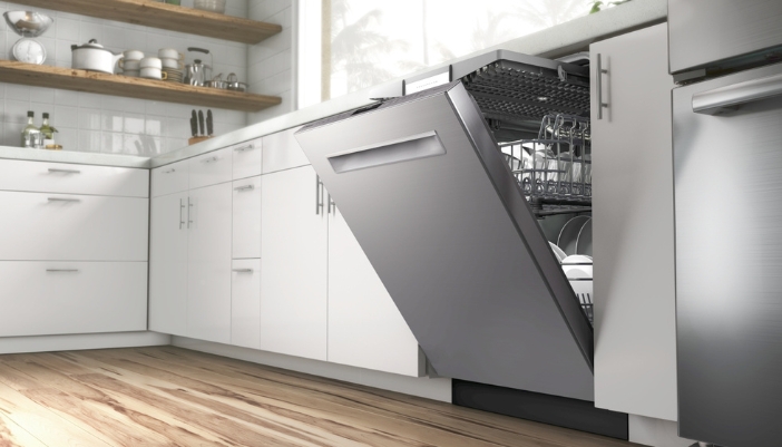 A dishwasher sits open in a modern kitchen. 