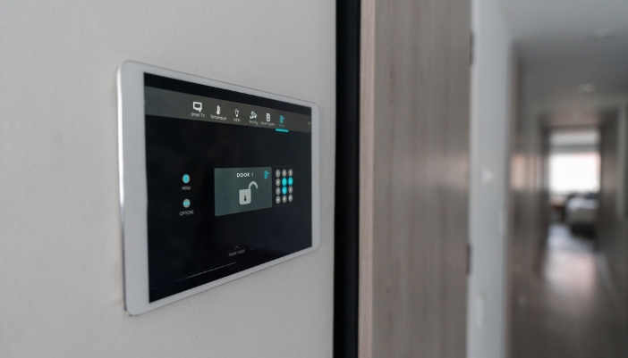 A control panel with the home's locking system on the screen
