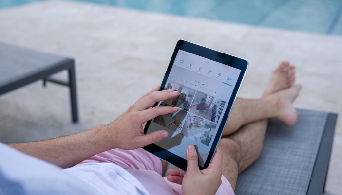 Closeup of a man checking his video feed while on vacation