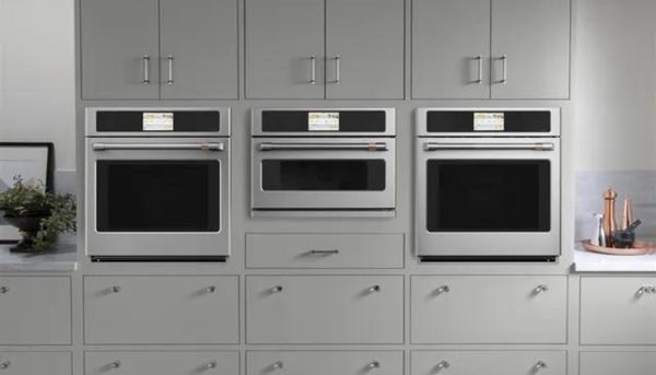 A kitchen wall featuring Cafe ovens