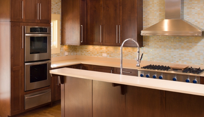 kitchen with double wall oven and wooden cabinets