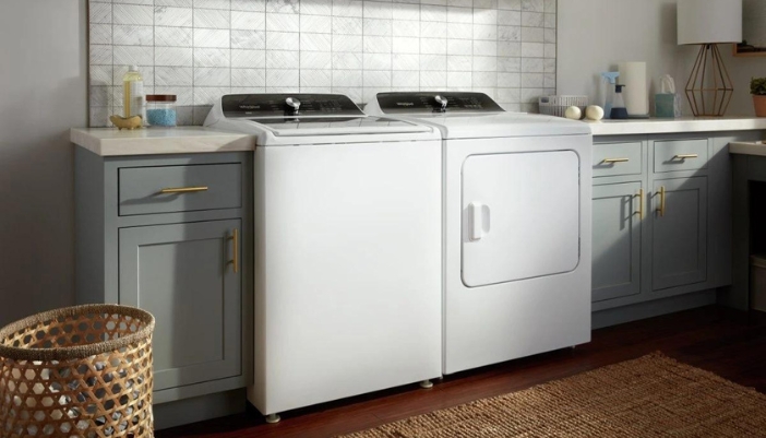 A Whirlpool top load washer paired witht he dryer