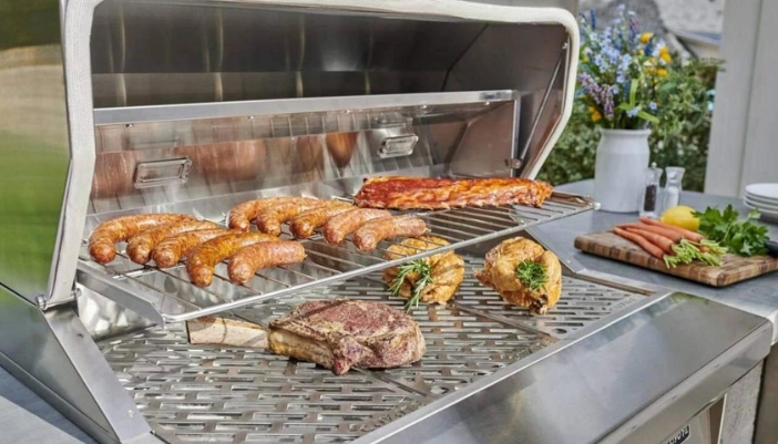 A Coyote grill with a built-in shelf