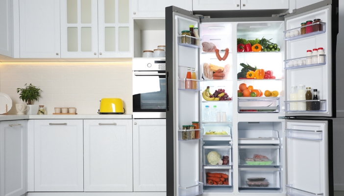 A side-by-side refrigerator open to show all compartments