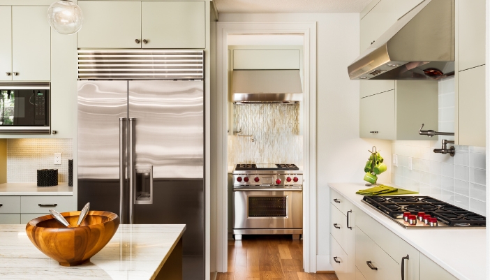 A beautiful kitchen with a brand new refrigerator
