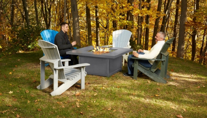 Older man and sun around a Napoleon firepit