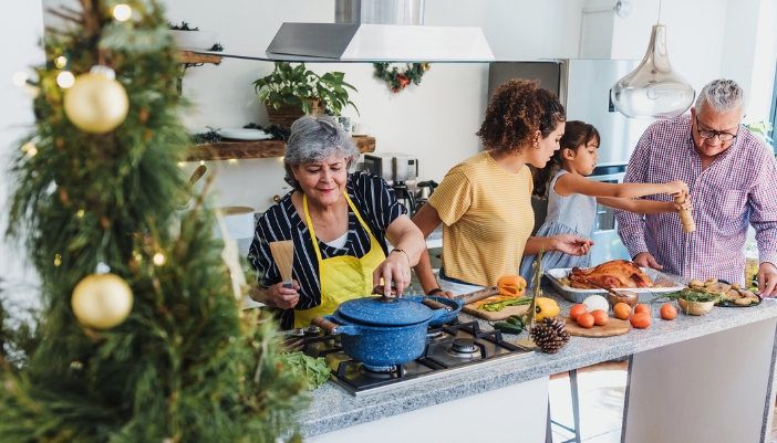 family cooking during holidays in kitchen
