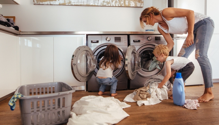 mom and kids doing laundry