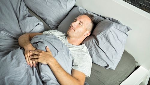 Man Sleeping on His Back