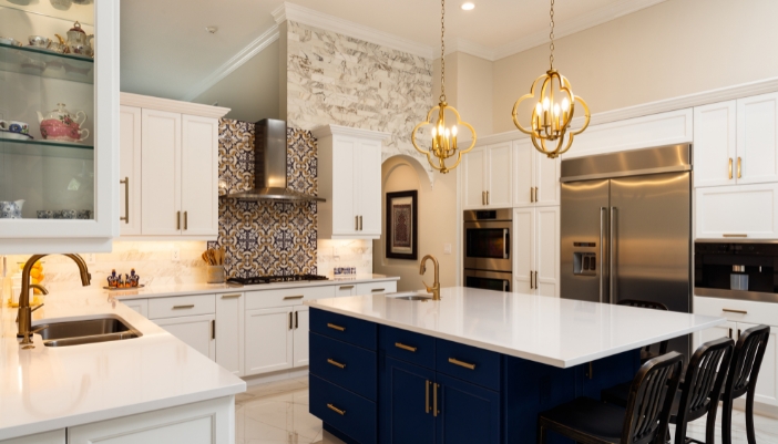luxury kitchen with white cabinets and stainless steel appliances
