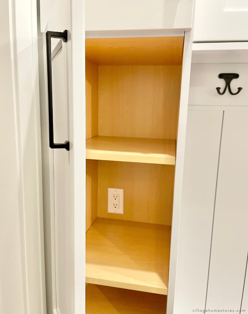 cabinet door open showing outlet inside