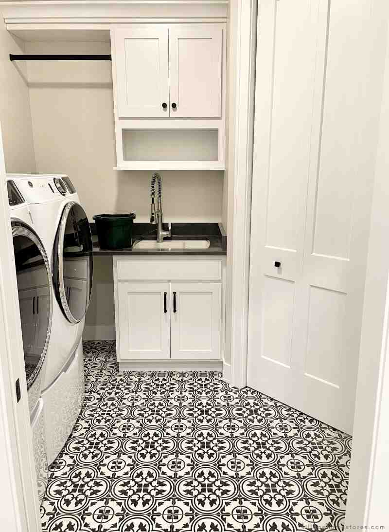 white laundry room cabinets with sink and open shelf above